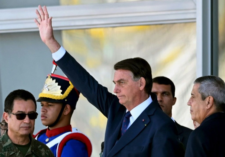 Brazilian President Jair Bolsonaro (C) presided over a military parade that drew criticism
