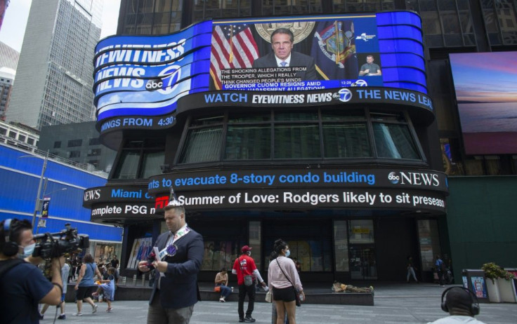 A screen in Times Square shows news coverage of New York Governor Andrew Cuomo's resignation announcement