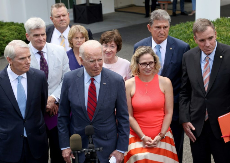 President Joe Biden speaks outside the White House with a bipartisan group of senators after meeting on the infrastructure deal