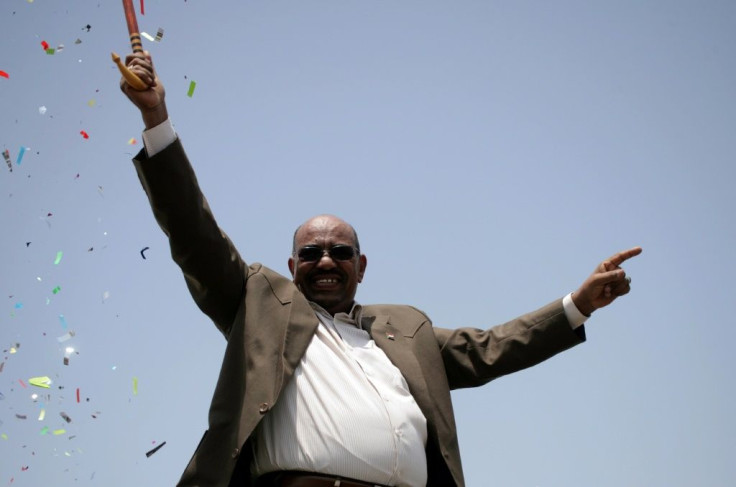 Bashir waves to the crowd at the inauguration of a factory near Al-Dewaim city in White Nile state on July 11, 2012