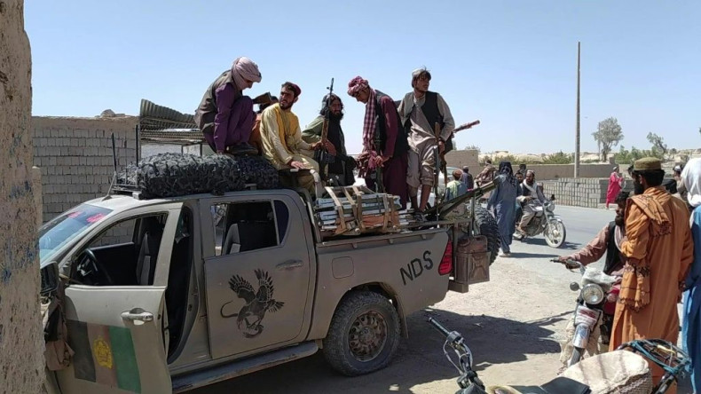 Members of the Taliban patrol the Afghan city of Farah in the country's west. Taliban fighters have now taken more than a quarter of Afghanistan's provincial capitals in less than a week.