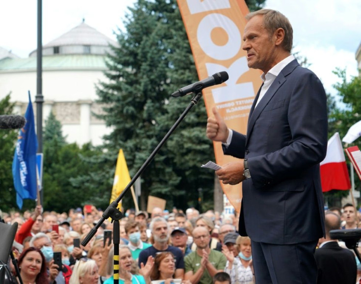 Donald Tusk, leader of the Polish opposition party Civic Platform and a former EU leader, speaks to demonstrators in defence of media freedom in Warsaw on Tuesday.