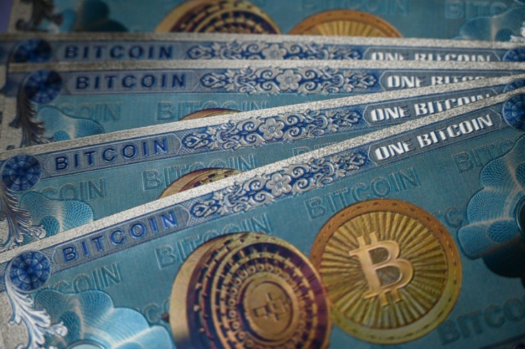 This illustration photograph  shows a physical banknote imitations of the Bitcoin crypto currency