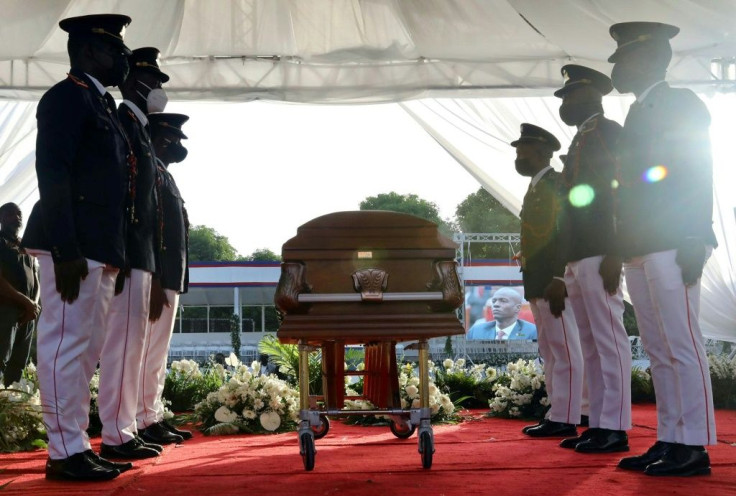 Soldiers guard the casket of slain President Jovenel Moise at his funeral on July 23, 2021, in Cap-Haitien, Haiti