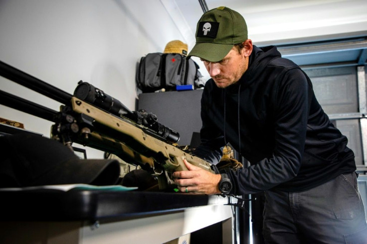 James Hintz's home is dotted with reminders of more than a decade of service, including photographs with fellow soldiers, rifles in a locked safe and medals tucked in a drawer