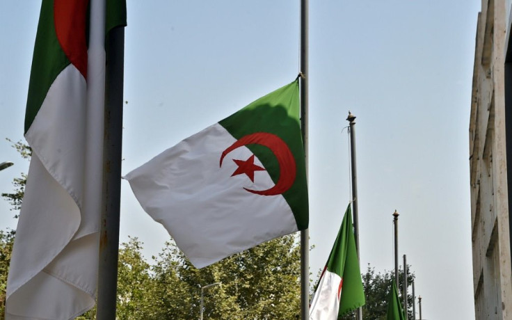 Flags of Algeria fly at half-mast in mourning for the victims of the Kabylie region forest fires in Algeria's capital Algiers, on August 12, 2021