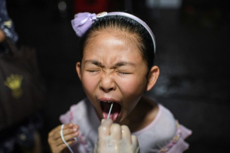 China has been testing residents of Wuhan for Covid-19 after a new outbreak in the city where the virus first emerged