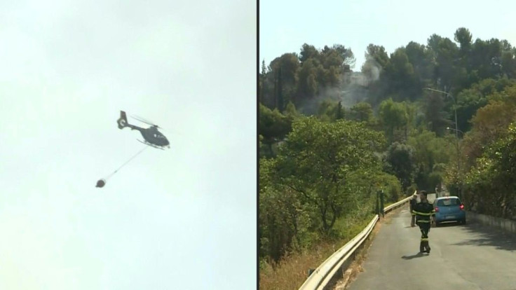 IMAGES Firefighters battle to extinguish a wildfire in the natural reserve of Monte Catillo in Tivoli, near Rome. Police and firefighters are investigating the cause of the fire. Searing heat is due to continue in Italy for several days and risks fuelling