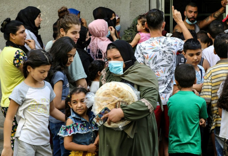 Lebanese flocked to bakeries before dawn Friday desperate to buy bread as the country's economic collapse deepens and shortages mount