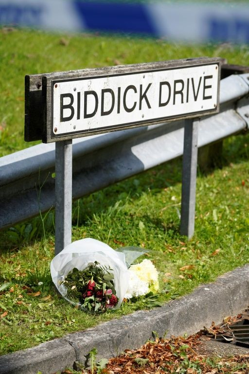 Floral tributes were laid near the scene of the mass shooting -- Britain's first in 11 years -- that left five people dead, including a three-year-old girl