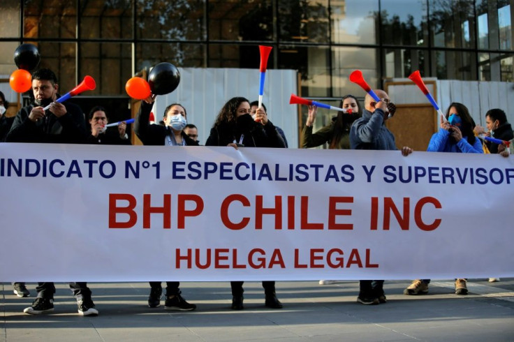 Escondida copper mine workers protest outside BHP Billiton's offices in Santiago in May 2021
