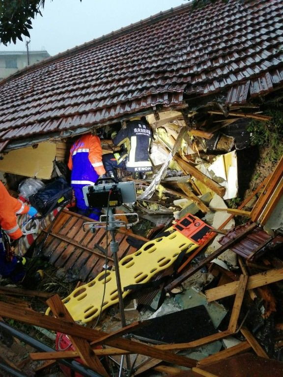 A 59-year-old woman died and two of her family members were missing after the landslide