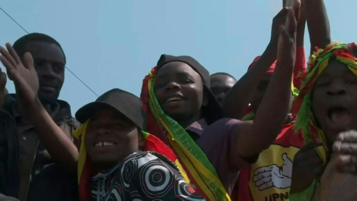 IMAGES  As Zambians await the results of the presidential election, supporters of Hakainde Hichilema, leader of the United Party for National Development (UPND) and long-time rival of President Edgar Lungu, gather outside the opposition party offices in t