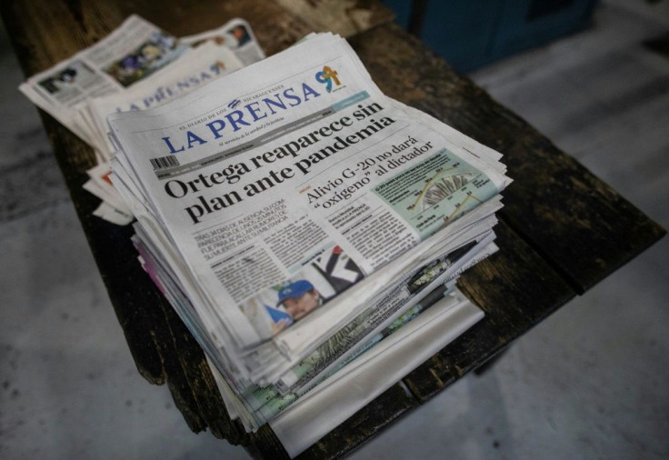A top editor of Nicaragua's La Prensa, Juan Lorenzo Holmann, has been arrested after a raid on the paper; he is the latest critic of President Daniel Ortega to be arrested
