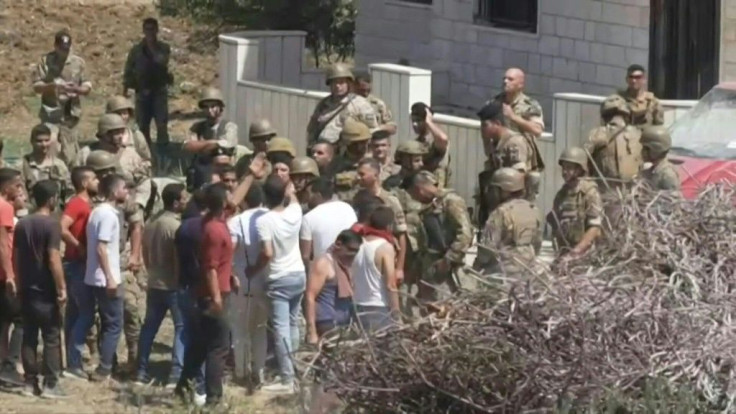 IMAGES Images of Lebanese security forces protecting the property of the fuel tanker owner from people hurling stones after an explosion that killed at least 20 people and wounded nearly 80 others when a fuel tanker exploded in Lebanon's northern region o