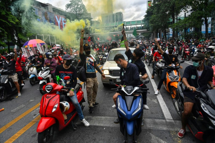 Protesters in cars and on bikes massed in Bangkok's central shopping district