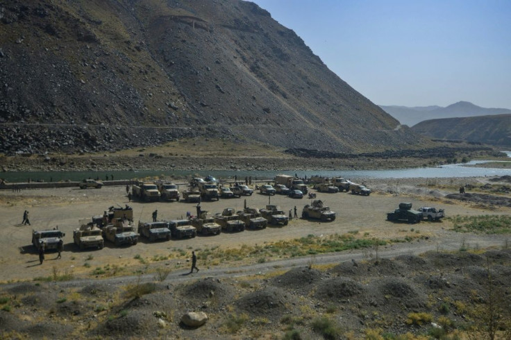 Armed humvee vehicles of Afghan Security forces are pictured along a path in Panjshir province