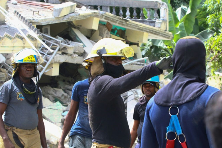 Rescue workers search through destroyed buildings in Les Cayes in southwestern Haiti, which was hit hard by a 7.2-magnitude earthquake on Saturday