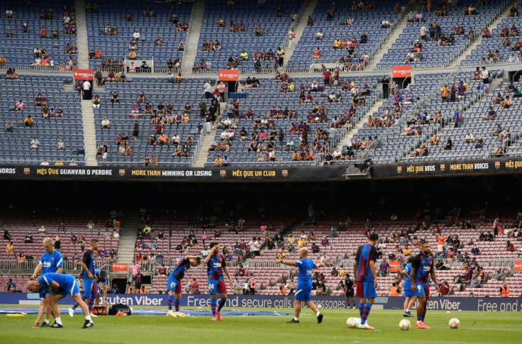 Life after Lionel: Barcelona's players warm up before the Spanish League match against Real Sociedad