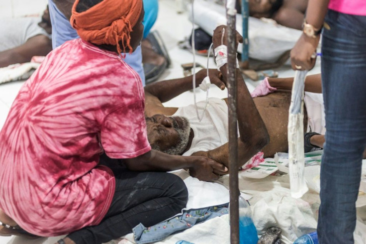 With little room to treat all the injured from the earthquake, many lay on the floor of the hospital in Les Cayes