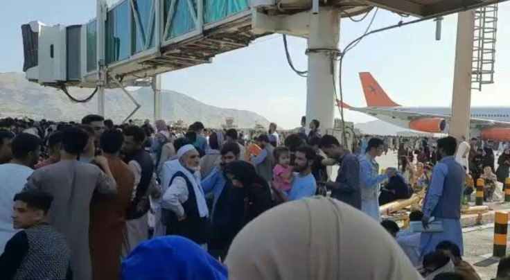 IMAGES Afghans crowd the airport in Kabul, waiting to board flights to leave Afghanistan after the Taliban retook control of the country.