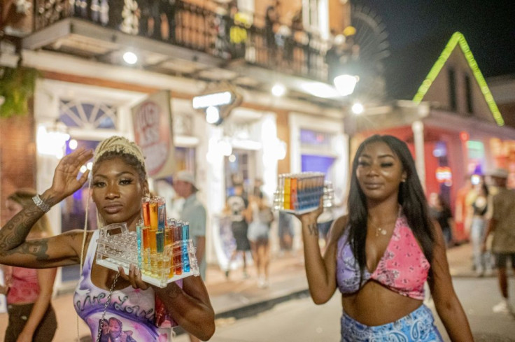 Every night, hundreds of tourists and partyers converge in New Orleans' French Quarter, with few sporting masks