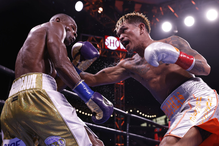 Guillermo Rigondeaux (L) fights John Riel Casimero (R) during their WBO Bantamweight title 12 round bout