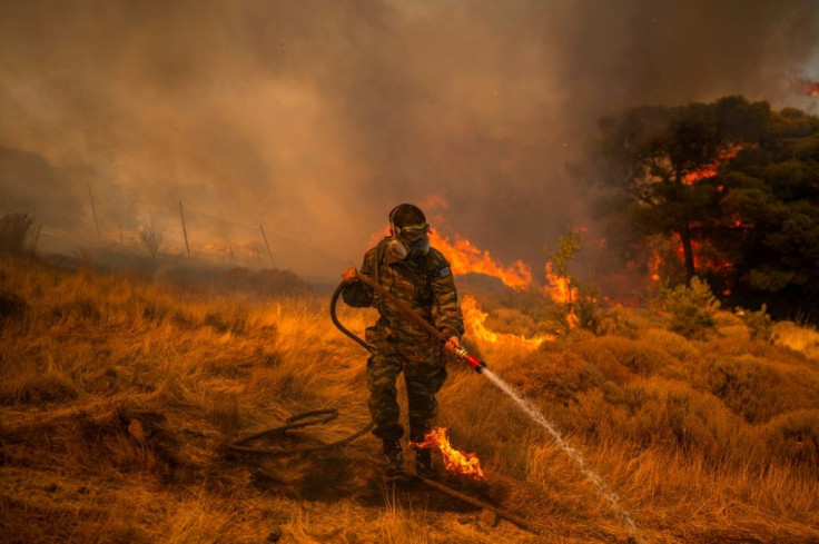 Scores of firefighters battled fresh blazes in Greece Monday, including near the village of Markati, near Athens
