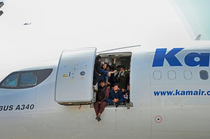 Afghans desperate to leave cram into an airliner at  Kabul airport
