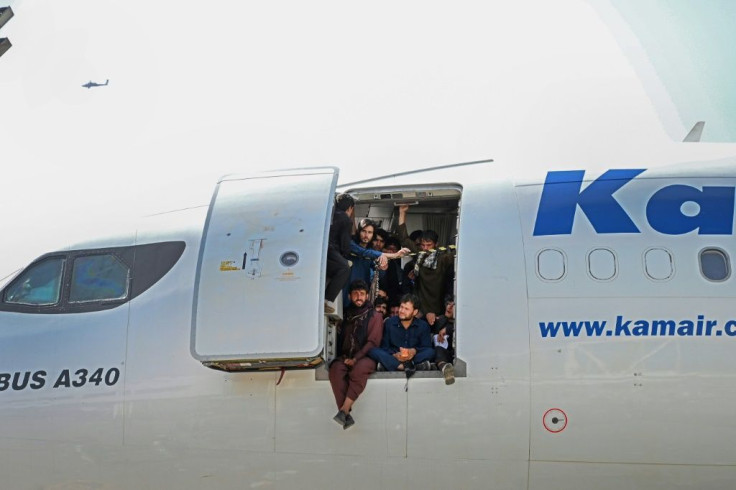 Afghans desperate to leave cram into an airliner at Kabul airport