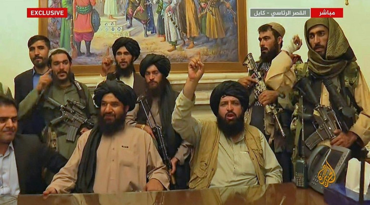 An image grab taken from Qatar-based Al-Jazeera t shows Members of Taliban taking control of the presidential palace in Kabul