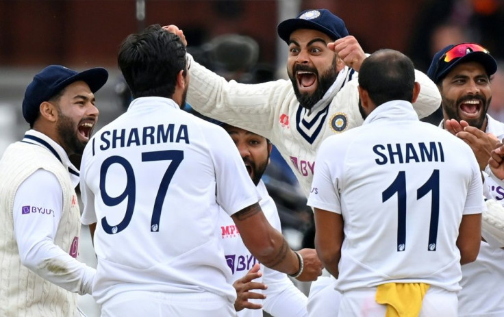 Elation - India captain Virat Kohli (3R) celebrates with Ishant Sharma (2L) and team-mates after a 151-run win over England in the second Test at Lord's on Monday