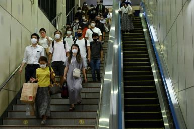 Japan's government will extend and expand a coronavirus state of emergency to battle a surge in infections