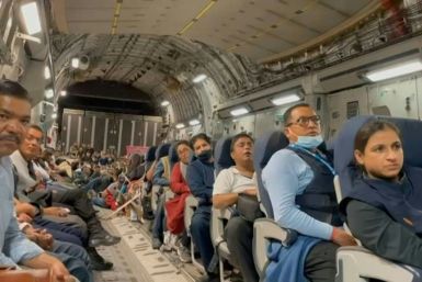 IMAGES People board an Indian military flight from Afghanistan as evacuation flights from Kabul's airport restart after chaos the previous day in which huge crowds mobbed the tarmac following the Taliban's takeover of the country.
