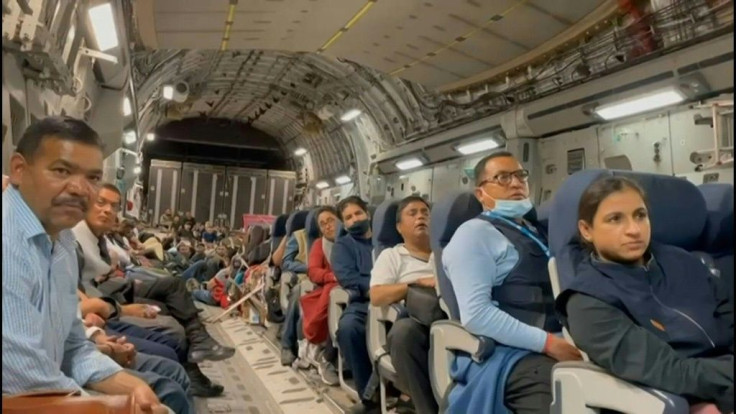 IMAGES People board an Indian military flight from Afghanistan as evacuation flights from Kabul's airport restart after chaos the previous day in which huge crowds mobbed the tarmac following the Taliban's takeover of the country.