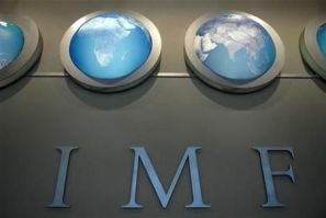 IMF nameplate is displayed on a wall at the headquarters during the World Bank/International Monetary Fund Spring Meetings in Washington