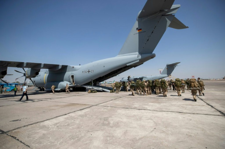 German troops board a plane in Tashkent, Uzbekistan, heading to Kabul