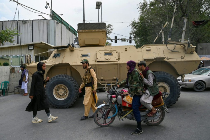 Taliban patrol Kabul in a US-made armored vehicle captured from the Afghan security forces