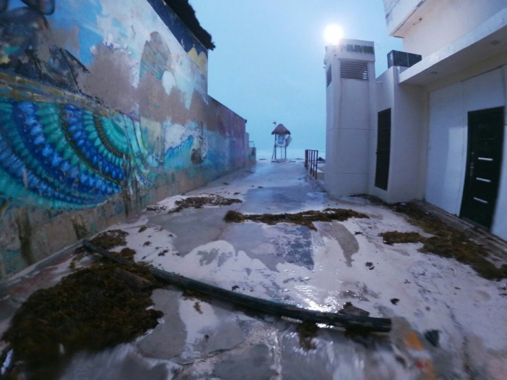 Intense wind and rain caused some damage to structures on the beach in the resort city of Cancun