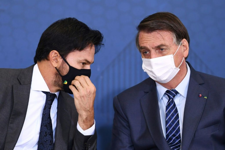 Brazilian President Jair Bolsonaro (R) and his Communication Minister Fabio Faria attended the launch event of the Week of Communication at the Planalto Palace in Brasilia on May 5, 2021
