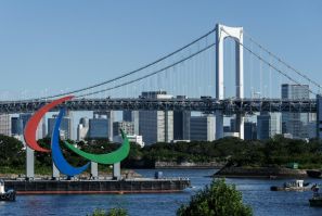 A giant red, blue and green Paralympic symbol was brought to the Tokyo waterfront on a barge
