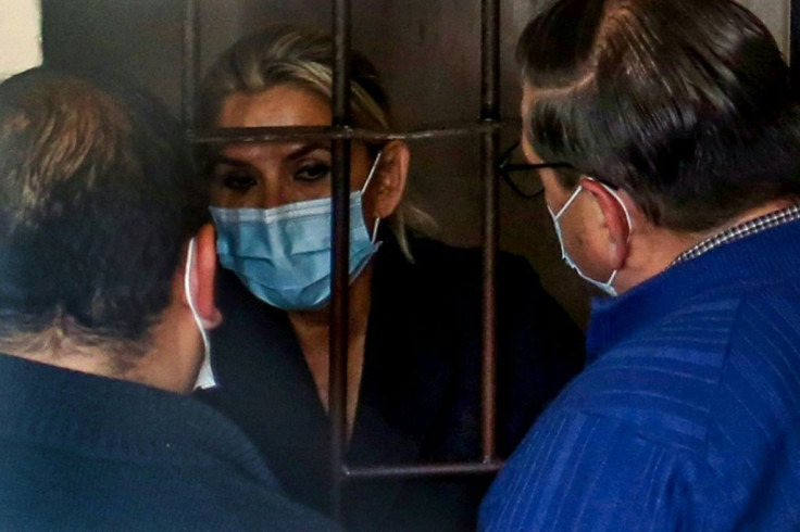 Former interim Bolivian president Jeanine Anez speaks with her lawyers in March 2021 from a prison cell after being arrested in La Paz