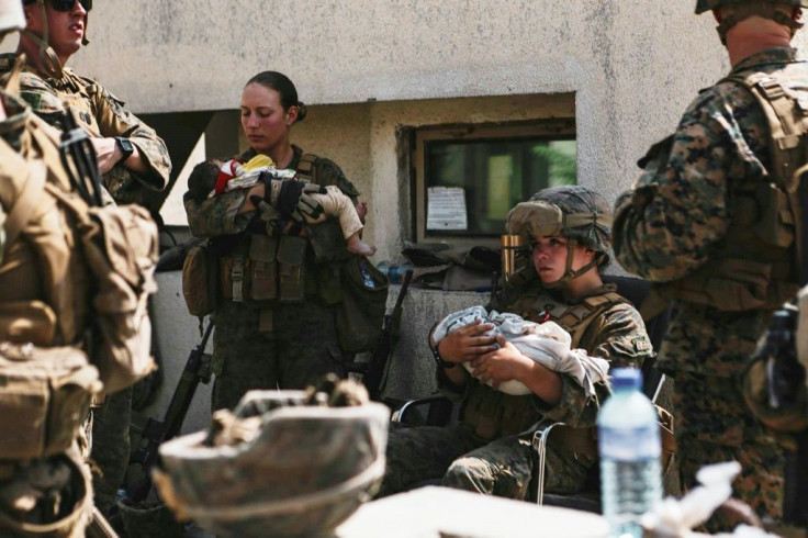 US Marines assigned to the 24th Marine Expeditionary Unit calmed infants at Kabul's airport in images distributed by the military