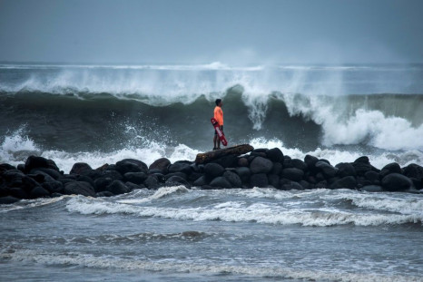 A lifeguard watches waves crash on the shore in Boca del Rio in Mexico's eastern state of Veracruz as Hurricane Grace nears