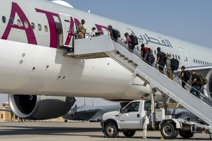 US embassy personnel evacuated from Afghanistan are flown on from Qatar to Kuwait on board a civilian aircraft