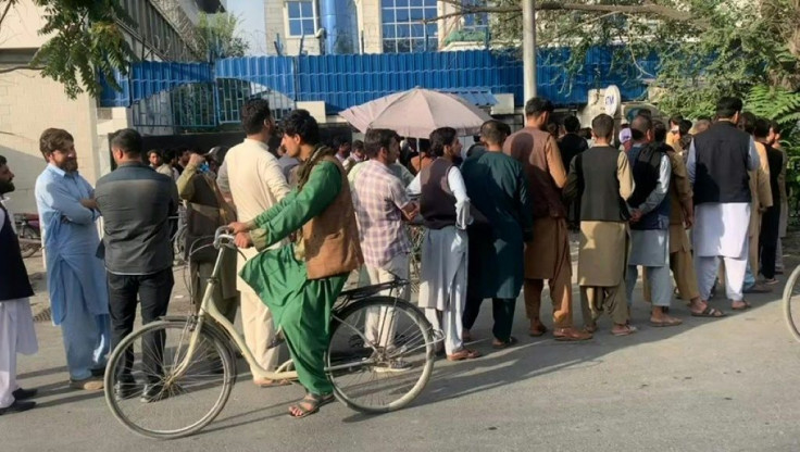 Afghans are queueing outside banks to withdraw cash from ATMs