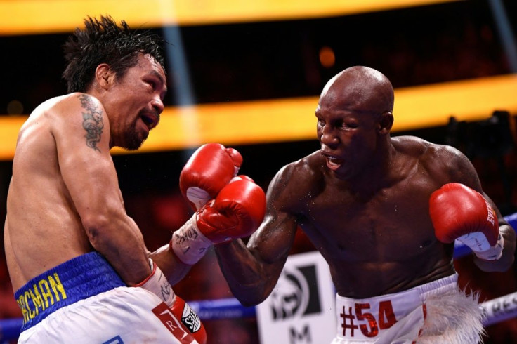 Filipino boxer Manny Pacquiao (left) trades blows with Cuba's Yordenis Ugas during the WBA welterweight title fight in Las Vegas