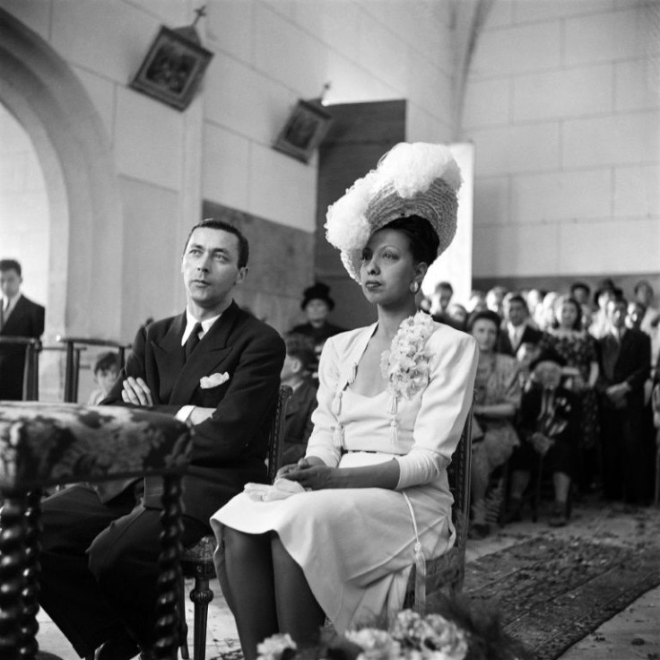 French US-born dancer and singer Josephine Baker and French conductor Jo Bouillon sit at their wedding mass in 1947 in the chapel of the Milandes Castle in Castelnaud-la-Chapelle, Dordogne, France.