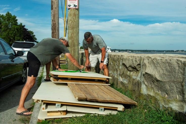 Members of a private beach association for Guthrie Beach tie down and disassemble beach huts prior to the arrival of Hurricane Henri in New London, Connecticut on August 21, 2021