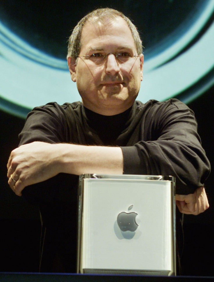 Apple Computer Inc. founder Steve Jobs poses with the company's new Power Mac G4 Cube